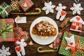 Christmas morning table with croissant and gifts. Top view