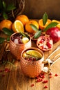 Christmas Moscow mule with pomegranate and orange Royalty Free Stock Photo