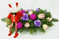 Christmas mouse on the background of the Christmas bouquet