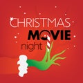 Christmas Movie Night text, Grinch green hand on red Royalty Free Stock Photo