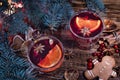 Christmas mulled red wine with and  ingredients on a wooden brown table. Traditional hot drink at Christmas holiday Royalty Free Stock Photo