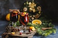 Christmas mulled red wine with spices, cranberry and fruits. Traditional Christmas hot drink. Christmas drink background Royalty Free Stock Photo