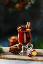 Christmas mulled red wine with spices, cranberry and fruits. Traditional Christmas hot drink. Christmas drink background Royalty Free Stock Photo