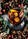 Christmas mulled red wine with spices, cranberry and fruits. Traditional Christmas hot drink. Christmas drink background Royalty Free Stock Photo