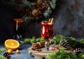 Christmas mulled red wine with spices, cranberry and fruits. Traditional Christmas hot drink. Christmas drink background Royalty Free Stock Photo