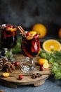 Christmas mulled red wine with spices, cranberry and fruits. Traditional Christmas hot drink. Christmas drink background Royalty Free Stock Photo