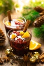 Christmas, New Year, Xmas mulled red wine with spices, cranberry and oranges. Traditional hot drink or beverage Royalty Free Stock Photo