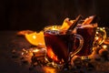 Christmas mulled red wine with spices and fruits on wooden rustic table. Traditional Christmas hot drink in festive light table