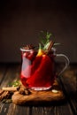 Christmas mulled wine with cranberry, orange, cinnamon, anise and rosemary. Traditional hot drink, Xmas or New Year cocktail Royalty Free Stock Photo