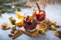 Christmas mulled wine delicious holiday like parties with orange cinnamon star anise spices. Traditional hot drink or beverage, Royalty Free Stock Photo