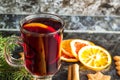 Christmas mulled wine with ginger biscuits orange cinnamon clove anise and fir tree on the dark table Royalty Free Stock Photo