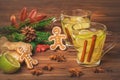 Christmas mulled wine with ginger, lime and cinnamon on wooden b