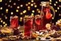 Christmas mulled wine or gluhwein with spices, chocolate sweets and orange slices on rustic table, traditional drink on winter Royalty Free Stock Photo