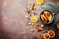 Christmas mulled wine or gluhwein with spices and orange slices on rustic table top view. Traditional drink on winter holiday. Royalty Free Stock Photo