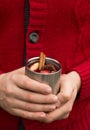 Christmas mulled wine in Hand of old man, delicious holiday like parties with orange cinnamon star anise spices. Traditional hot Royalty Free Stock Photo
