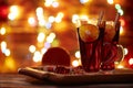 Christmas mulled wine red in a glass with a stick of cinnamon and a piece of orange