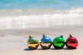 Christmas multicolored decoration balls on seashore