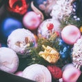 Christmas multicolored toys, textured balls lie in an open box, effect of the instagram Royalty Free Stock Photo