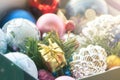 Christmas multicolored toys, textured balls lie in an open box, effect of the instagram Royalty Free Stock Photo