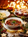 Christmas mushroom soup, a traditional vegetarian mushroom soup made with dried forest mushrooms in a ceramik plate on a festive