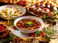 Christmas mushroom soup, a traditional vegetarian mushroom soup made with dried forest mushrooms in a ceramik plate on a festive