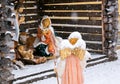 Christmas nativity scene, angel with lamb in the snow Royalty Free Stock Photo