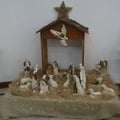 Christmas nativity scene with baby Jesus in a manger, animals and people. Plaster reproduction Royalty Free Stock Photo