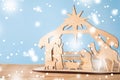 Christmas Nativity Scene of baby Jesus in the manger with Mary and Joseph in silhouette surrounded by the animals Royalty Free Stock Photo