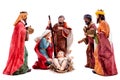 Christmas nativity scene with the Holy Family and the three wise men, isolated on white background Royalty Free Stock Photo