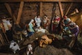 Christmas nativity scene with baby Jesus, Mary, Joseph and three kings in barn Royalty Free Stock Photo
