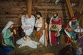 Christmas nativity scene with baby Jesus, Mary and three kings in barn