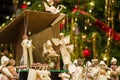 Christmas nativity scene with blurred Chrstmas tree in background