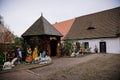 Christmas nativity scene, colorful figures, village school, historic country-style architecture in Skanzen, Polabi open-air