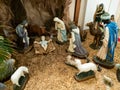 Christmas nativity scene with figurines including Jesus, Mary, Joseph, sheep and wizards Royalty Free Stock Photo