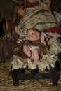 Christmas nativity scene - Jesus Christ, Mary and Joseph. Wooden figurines, donkey in the background