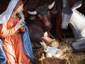 Christmas. Nativity scene with life size statues and baby Jesus Royalty Free Stock Photo