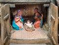 Christmas nativity scene represented with statuettes of Mary, Joseph and baby Jesus Royalty Free Stock Photo