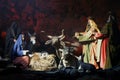 Christmas nativity scene with three Wise Men presenting gifts to baby Jesus, Mary & Joseph Royalty Free Stock Photo