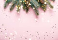 Christmas natural coniferous border with cones and confetti. Festive pink background with sparkles and bokeh lights Royalty Free Stock Photo