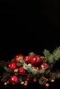 Christmas and New year. Apples with pine cones and nuts in a basket with fir branches. Gifts and candles. Royalty Free Stock Photo