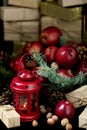 Christmas and New year. Apples with pine cones and nuts in a basket with fir branches. Gifts and candles. Royalty Free Stock Photo