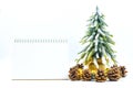 Christmas or New Year background with blank note pad,pine cones,gift box,golden ball and pine tree of Xmas decorations and fir br Royalty Free Stock Photo