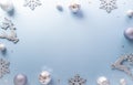 Christmas and new year background concept. Top view of Christmas star and snowflake on pastel blue background
