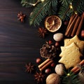 Christmas or New Year background with cookies, spices, cinnamon, nuts and fir tree branch on dark wooden background Royalty Free Stock Photo