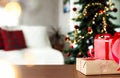 Christmas, New Year background. Empty wooden tabletop with bokeh fir tree, gift Royalty Free Stock Photo