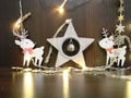 Christmas and New year background with empty dark wooden deck table over christmas tree and blurred light Royalty Free Stock Photo