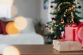 Christmas, New Year background. Empty wooden tabletop with bokeh fir tree, gift Royalty Free Stock Photo