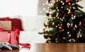 Christmas, New Year background. Empty wooden tabletop with bokeh fir tree, gift Royalty Free Stock Photo