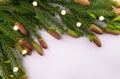Christmas and New Year background from a fir branch with cones and small lanterns. Copy space. Royalty Free Stock Photo