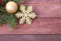 Christmas or New Year background: fur-tree, branches, colored glass balls , decoration and cones on a wooden background Royalty Free Stock Photo